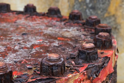 Rusted and corroded old pipeline lid bolts detail close-up, Mossel Bay, South Africa