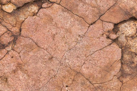 Fractured flat face surface of natural weathered granite rock, South Africa