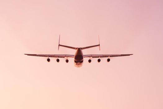 Antonov An-225 Mriya aircraft after take off from the Gostomel airport at sunset in Kyiv, Ukraine. This giant cargo plane is the heaviest aircraft ever built. Summer 2018