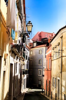 Old colorful houses and narrow streets of Lisbon, Portugal in Spring.