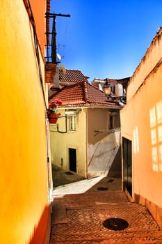 Narrow and colorful streets, majestic facades, windows and balconies of Lisbon, Portugal