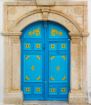 Blue door with ornament as symbol of Sidi Bou Said in Tunisia