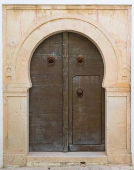 Aged door with ornament and tiles from Sidi Bou Said in Tunisia