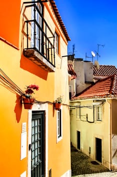 Narrow and colorful streets, majestic facades, windows and balconies of Lisbon, Portugal