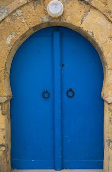 Traditional blue arched door from Sidi Bou Said in Tunisia