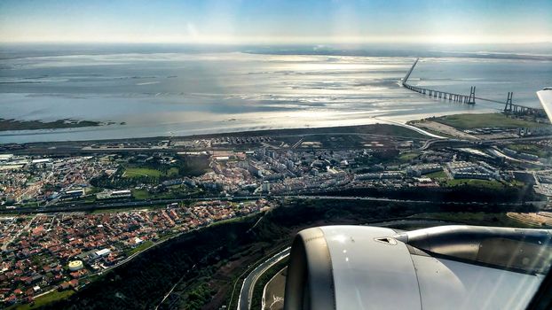 Aerial view of Lisbon and Tagus River. Vasco da Gama bridge in the background