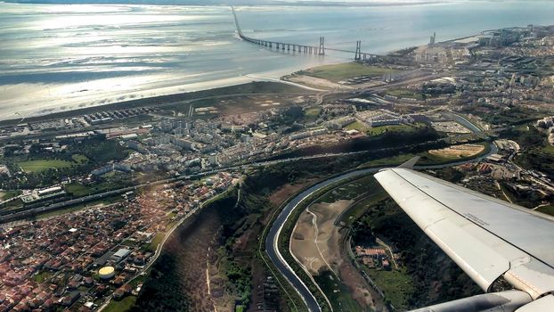 Aerial view of Lisbon and Tagus River. Vasco da Gama bridge in the background