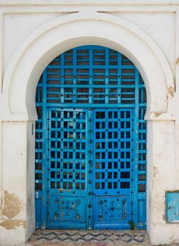 Blue aged door with ornament from Sidi Bou Said