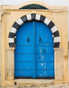 Traditional blue arched door from Sidi Bou Said in Tunisia