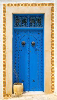 Aged Blue door in Andalusian style from Sidi Bou Said in Tunisia