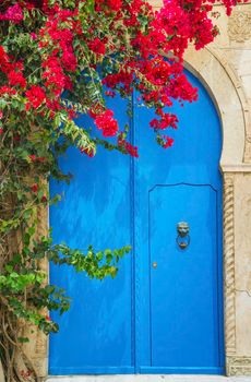 Aged Blue door in Andalusian style from Sidi Bou Said in Tunisia