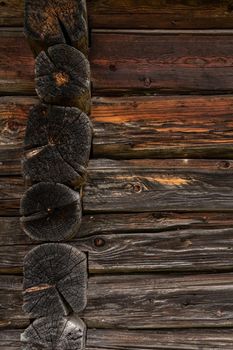 Wooden log cabin or felling  Rustic texture or background. Aged wood wall and boards