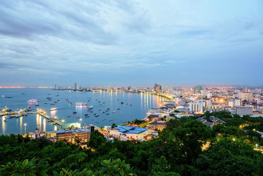 High view on viewpoint see cityscape with colorful light at the beach and the sea of Pattaya Bay, beautiful landscape of Pattaya City at sunset landmark in Chonburi, Travel Asia to Thailand