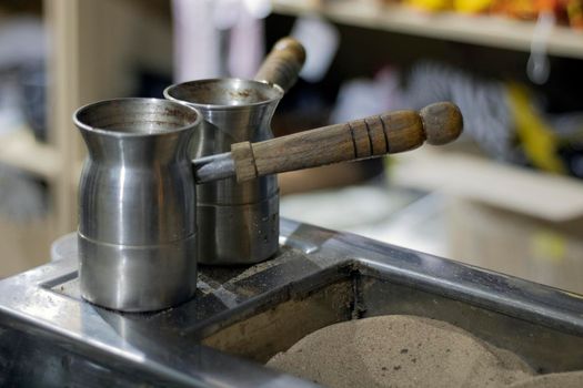 traditional Turkish coffee in Turku on the sand, selective focus.