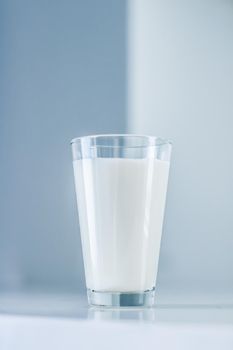 Dairy, healthy nutrition and breakfast concept - World Milk Day, full glass on marble table