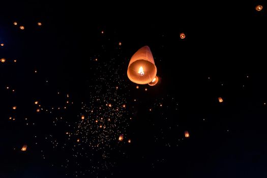 Floating lanterns on sky in Loy Krathong Festival or Yeepeng Festival , traditional Lanna Buddhist ceremony in Chiang Mai, Thailand