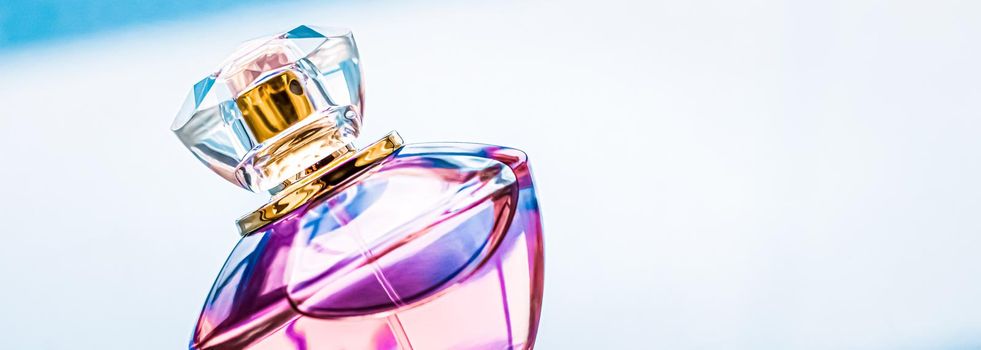 Perfume bottle on glossy background, sweet floral scent, glamour fragrance and eau de parfum as holiday gift and luxury beauty cosmetics brand design.