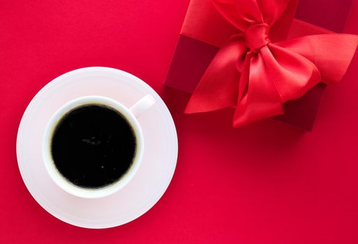 Romantic celebration, lifestyle and birthday present concept - Luxury beauty gift box and coffee on red, flatlay