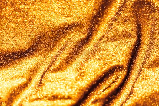 Luxe glowing texture, night club branding and New Years party concept - Golden holiday sparkling glitter abstract background, luxury shiny fabric material for glamour design and festive invitation