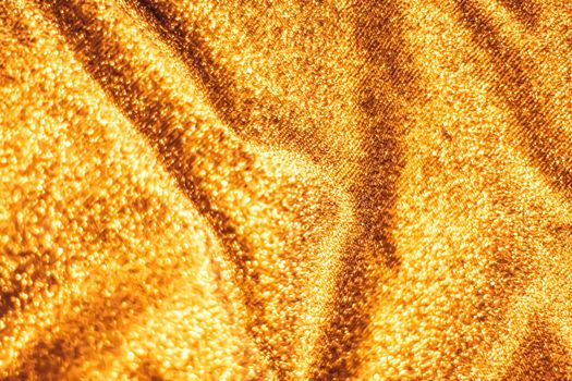 Luxe glowing texture, night club branding and New Years party concept - Golden holiday sparkling glitter abstract background, luxury shiny fabric material for glamour design and festive invitation