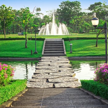 Fountain in the park walking the green.