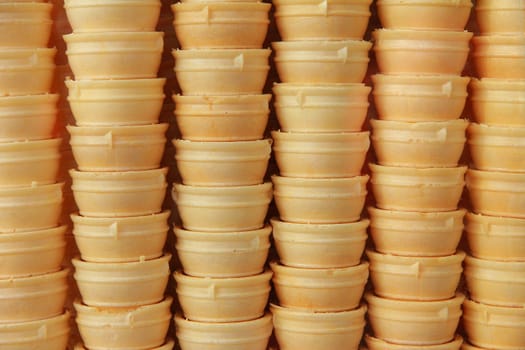 Background of ice cream cones. In a row.