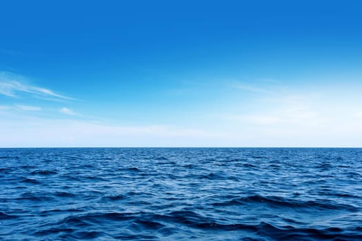 Blue sea with waves and wind. And the sky as background.