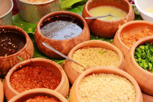 Condiment that tastes sweet, salty, sour and spicy.