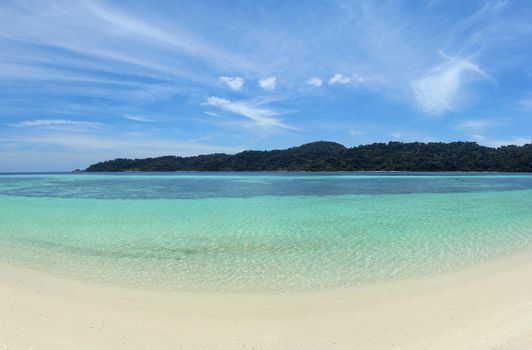 Background clean sea sand and sky islands.