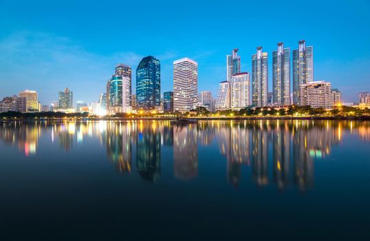 Bangkok city downtown at night with reflection of skyline, Bangkok,Thailand