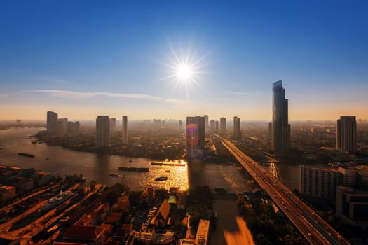 Chao Phraya river and high building sky scrapper in heart of bangkok thailand