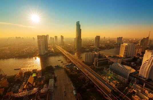 Chao Phraya river and high building sky scrapper in heart of bangkok thailand