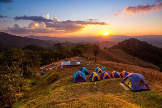 Activities tent on a hill in the countryside.