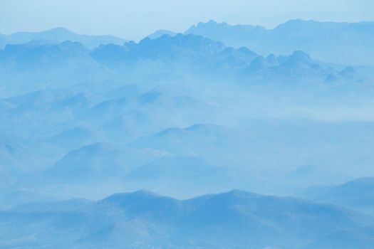 mountains under mist in the morning.