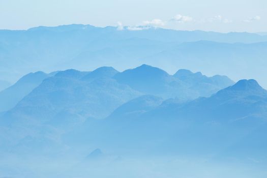 mountains under mist in the morning.