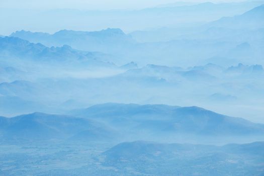 mountains under mist in the morning.