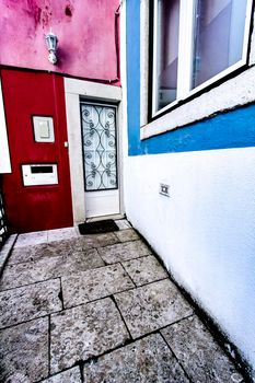Old colorful and beautiful facades with vintage streetlight in Lisbon streets in Spring.