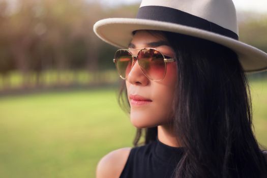 Young woman relaxing with good weather in the park.