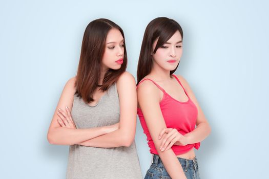 Two girls looking each other angry 
