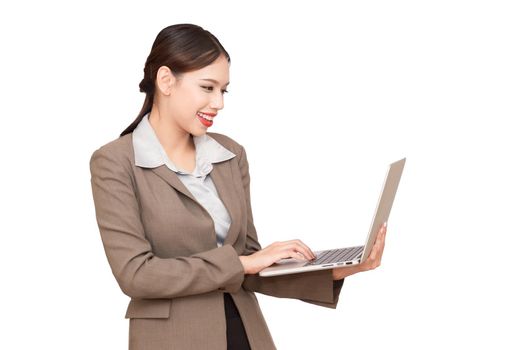 Portrait of a cute businesswoman using a laptop.isolated on white background.