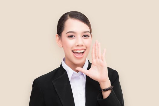 portrait of pretty businesswoman loud screaming or calling out to someone