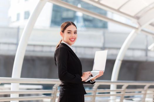 Young business woman using notebook mobile computer