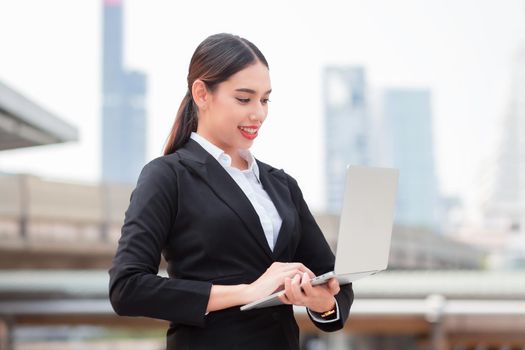 Young business woman using notebook mobile computer