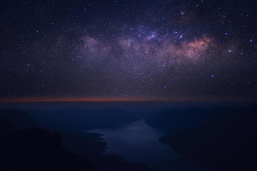 Clearly Milky way above the lake and mountain. Pha Dang Luang view point, Mae Ping National park.Thailand