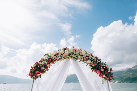 Wedding Arch on the beach in Montenegro. Panoramic views of the mountains and the Bay of Kotor