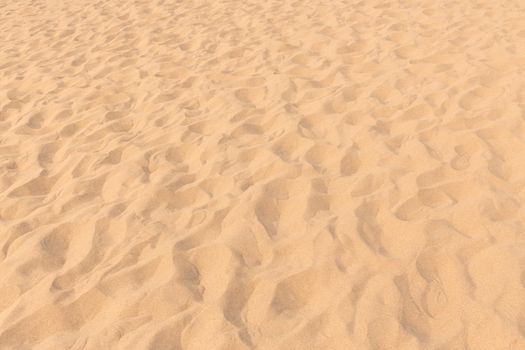closeup of sand pattern of a beach in the summer
