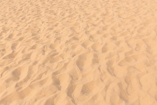 closeup of sand pattern of a beach in the summer