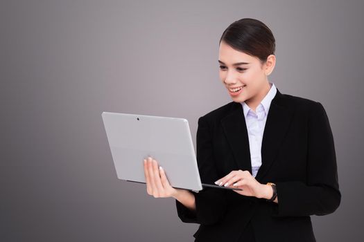 Portrait of beautiful young woman holding digital tablet