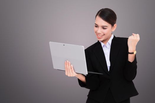 Portrait of beautiful young woman holding digital tablet