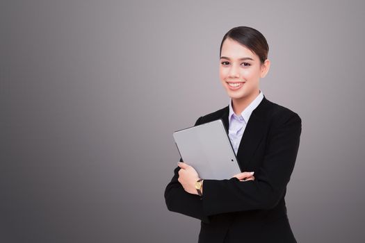 Portrait of beautiful young woman holding digital tablet